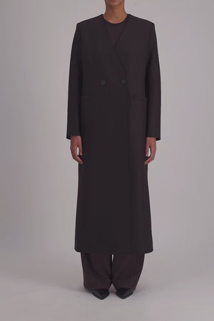 Uncollared coat with shoulder pads pressed wool