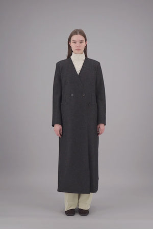Uncollared coat with shoulder pads pressed wool